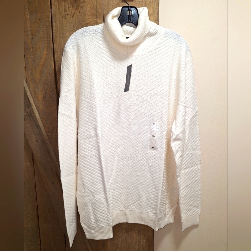An INC International Concepts cream color turtleneck sweater in a women's XL.NWT
